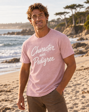 Load image into Gallery viewer, Men's Salt Hound Character over Pedigree T-shirt in Heather Soft Pink, modeled view